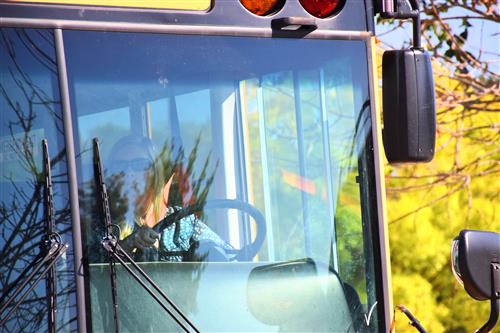 closeup of driver at wheel of the bus 